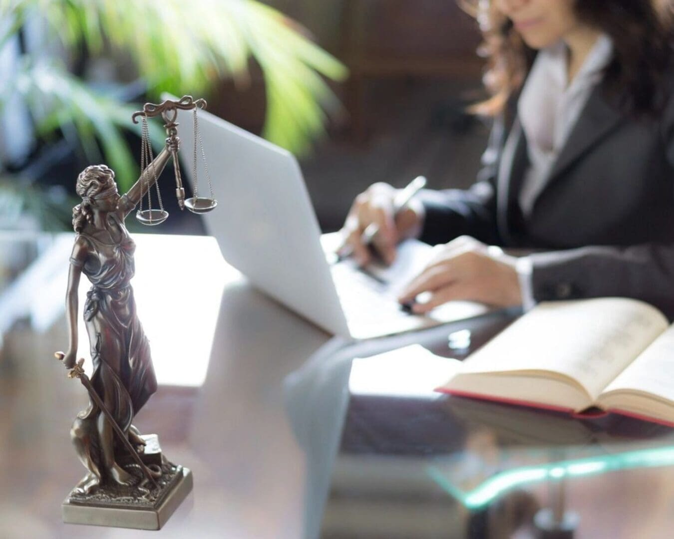 O'Connor Legal — scales of justice and lawyer at work